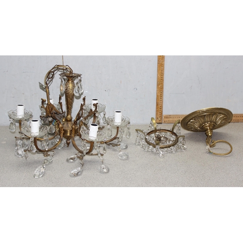 244 - 2 gilt-brass crystal chandeliers of different forms