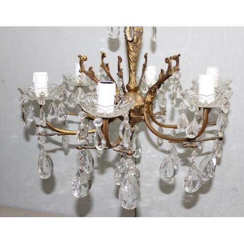 244 - 2 gilt-brass crystal chandeliers of different forms