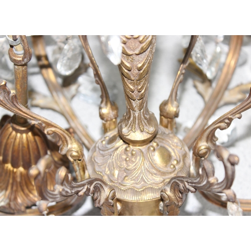 244 - 2 gilt-brass crystal chandeliers of different forms