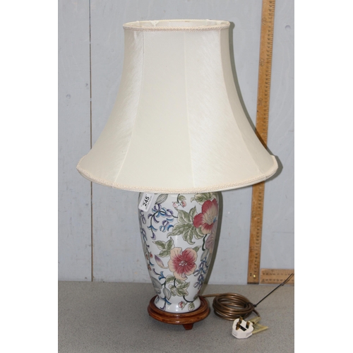 245 - An Oriental polychrome decorated pottery table lamp with shade, approx 68cm tall