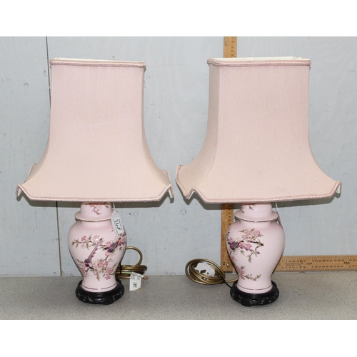 248 - A pair of Oriental pottery table lamps with pink shades, approx 59cm tall, by Lightolier