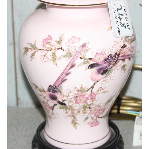 248 - A pair of Oriental pottery table lamps with pink shades, approx 59cm tall, by Lightolier