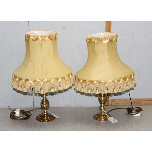 251 - A pair of vintage brass table lamps with gold shades, approx 49cm tall