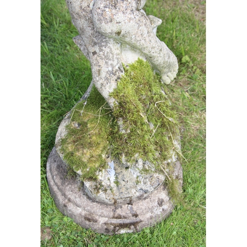 333 - A weathered concrete garden bird bath formed as a young boy holding a clam shell, approx 90cm tall