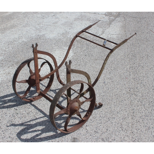 340 - A vintage wrought iron barrel trolley, approx 65cm x 110cm