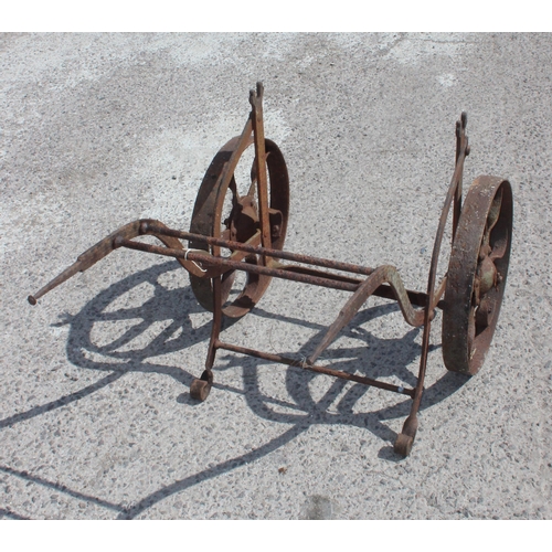 340 - A vintage wrought iron barrel trolley, approx 65cm x 110cm