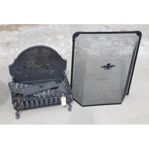 343 - A cast iron fire grate with back and spark guard