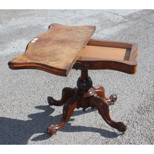 4 - A Victorian walnut fold over card table with baize line interior, with carved base and frieze, appro... 