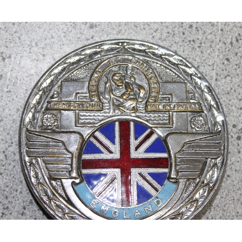 704 - A vintage chrome and enamel St Christopher car badge with Union Jack flag car badge