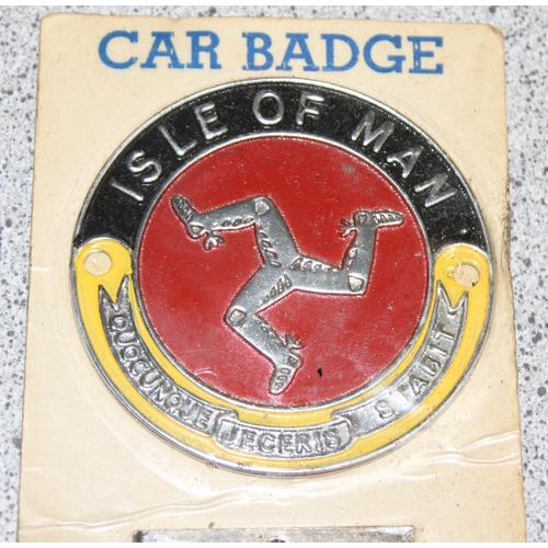 705 - A vintage Cornwall car badge and a NOS Isle of Man car badge in original packaging (2)