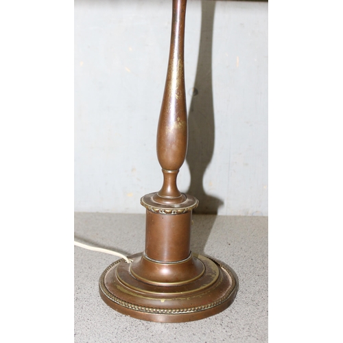 267 - An unusual vintage brass lamp with a woven wickerwork shade, approx 42cm tall