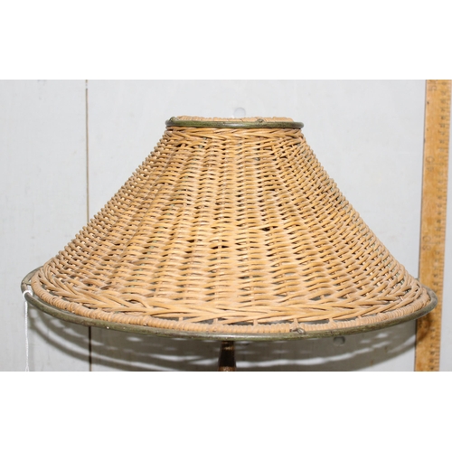 267 - An unusual vintage brass lamp with a woven wickerwork shade, approx 42cm tall