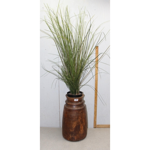 293 - A large African turned wooden vase, currently housing a faux plant, vase approx 48cm tall