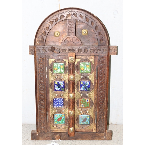 295 - A miniature Omani wooden door display with tiles, approx 50cm x 31cm