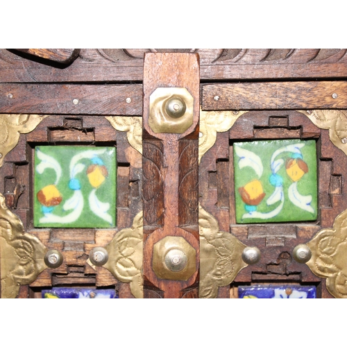 295 - A miniature Omani wooden door display with tiles, approx 50cm x 31cm