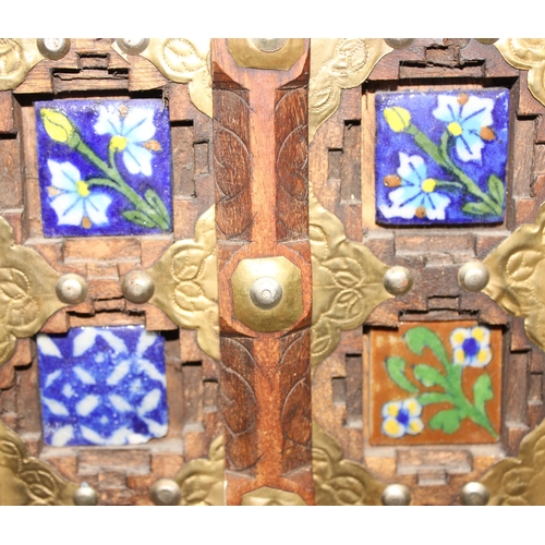 295 - A miniature Omani wooden door display with tiles, approx 50cm x 31cm