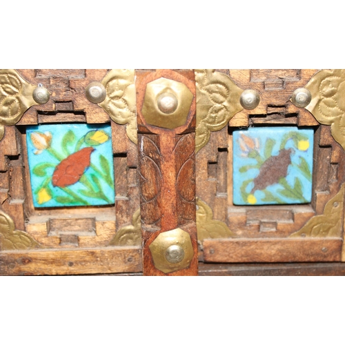 295 - A miniature Omani wooden door display with tiles, approx 50cm x 31cm