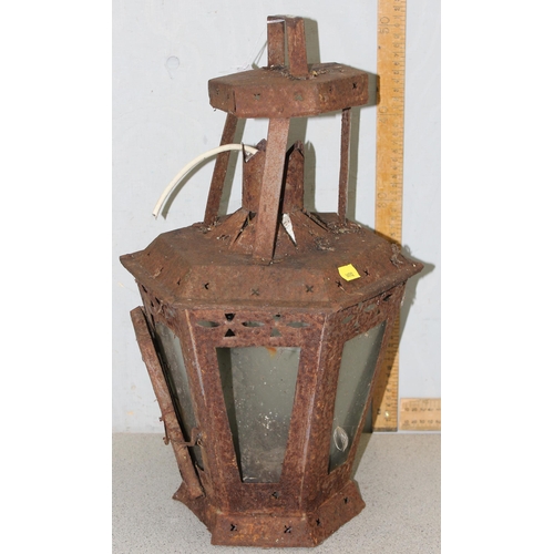 353 - 2 large weathered metal garden lanterns, the largest approx 60cm tall