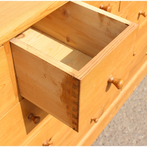 155 - A modern pine chest of drawers with 19 drawers, approx 180cm wide x 48cm deep x 94cm tall