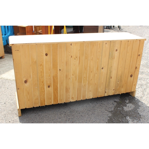 155 - A modern pine chest of drawers with 19 drawers, approx 180cm wide x 48cm deep x 94cm tall