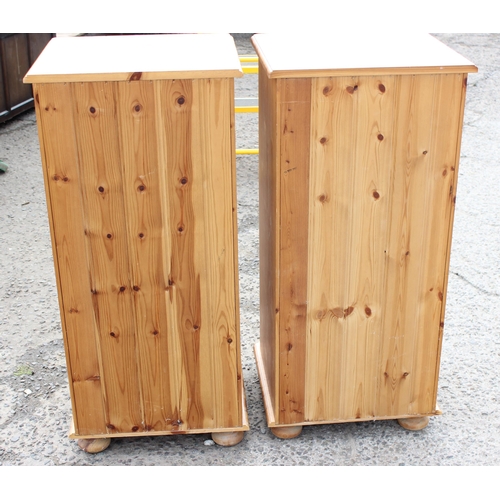 159 - A pair of modern pine 5 drawer bedside cabinets, each approx 46cm wide x 42cm deep x 98cm tall