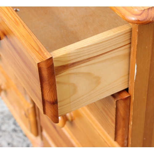 160 - A pair of modern pine 5 drawer bedside cabinets, each approx 35cm wide x 41cm deep x 85cm tall