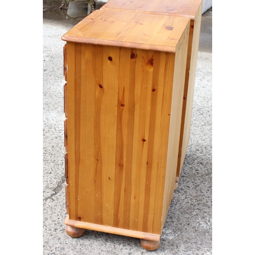 160 - A pair of modern pine 5 drawer bedside cabinets, each approx 35cm wide x 41cm deep x 85cm tall