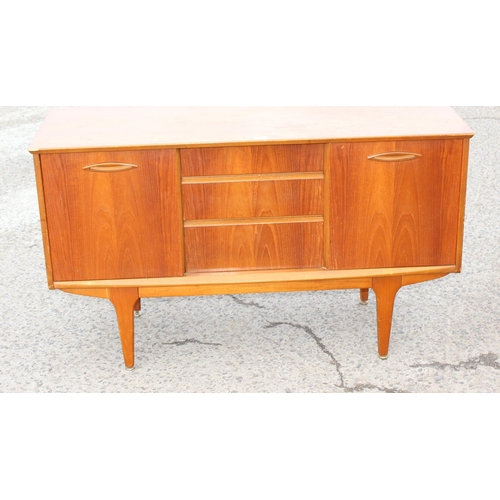 166 - A retro petite sideboard with 3 drawers flanked by 2 cupboards, seemingly unmarked but possibly Jent... 