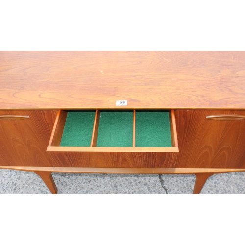 166 - A retro petite sideboard with 3 drawers flanked by 2 cupboards, seemingly unmarked but possibly Jent... 