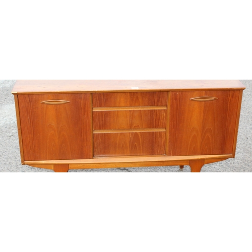 166 - A retro petite sideboard with 3 drawers flanked by 2 cupboards, seemingly unmarked but possibly Jent... 