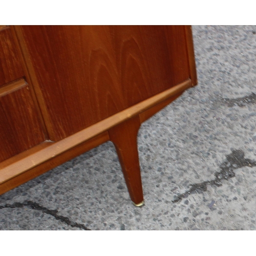 166 - A retro petite sideboard with 3 drawers flanked by 2 cupboards, seemingly unmarked but possibly Jent... 