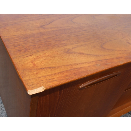 166 - A retro petite sideboard with 3 drawers flanked by 2 cupboards, seemingly unmarked but possibly Jent... 