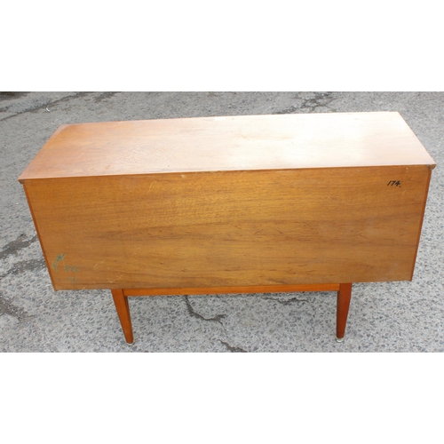 166 - A retro petite sideboard with 3 drawers flanked by 2 cupboards, seemingly unmarked but possibly Jent... 