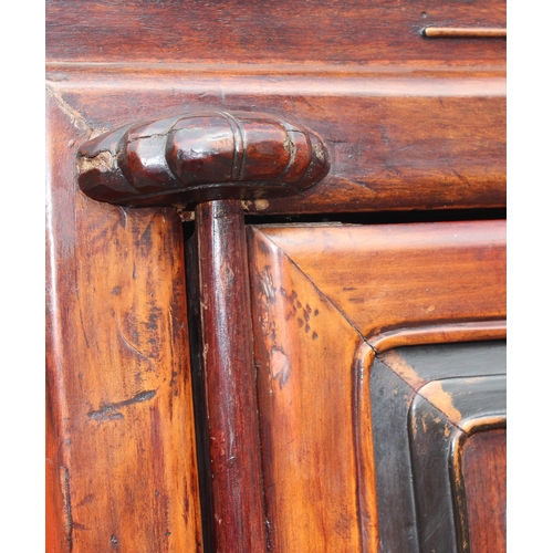 167 - A Chinese hardwood cabinet, the doors opening to reveal 3 shelves and a single drawer, likely early ... 