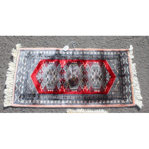 210A - 3 small vintage rugs, the largest approx 103cm x 48cm