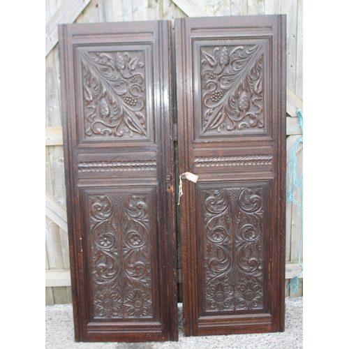 181 - A pair of antique carved oak doors, each approx 55cm wide x 166cm tall, by Edwards & Roberts