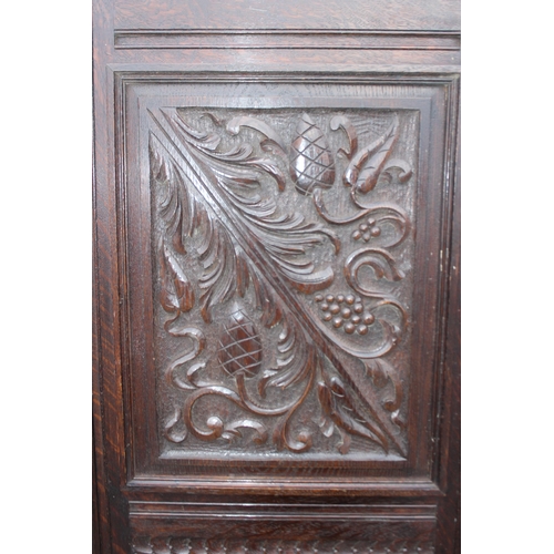 181 - A pair of antique carved oak doors, each approx 55cm wide x 166cm tall, by Edwards & Roberts