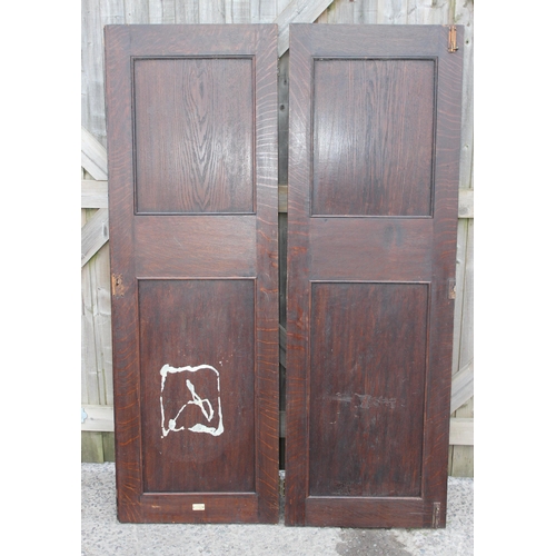 181 - A pair of antique carved oak doors, each approx 55cm wide x 166cm tall, by Edwards & Roberts