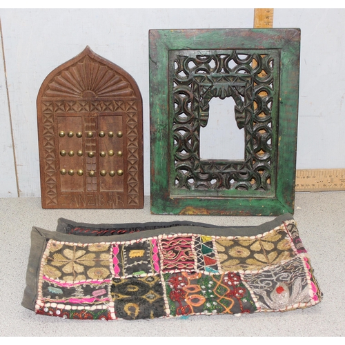 1824 - 2 African carved wooden wall plaques and an Indian fabric wall hanging (3)