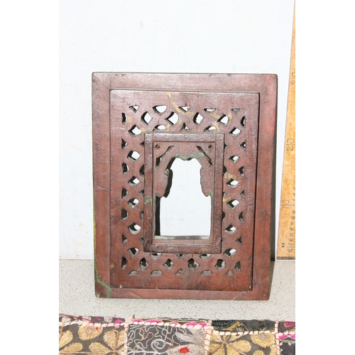 1824 - 2 African carved wooden wall plaques and an Indian fabric wall hanging (3)