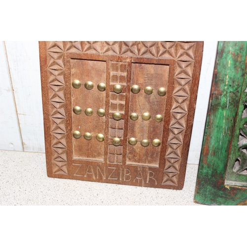 1824 - 2 African carved wooden wall plaques and an Indian fabric wall hanging (3)