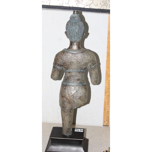 269B - A large table lamp and shade, the base formed as aN Oriental figure from antiquity, approx 96cm tall