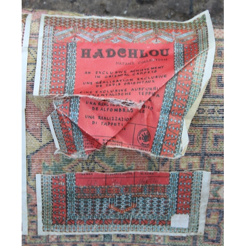 208 - A vintage Hadchlou wool rug, with labels, approx 230cm x 158cm