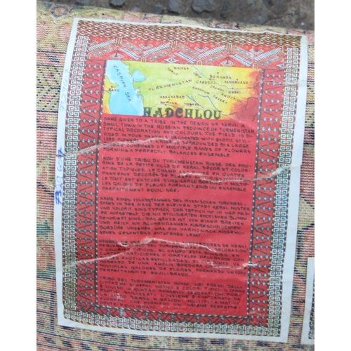 208 - A vintage Hadchlou wool rug, with labels, approx 230cm x 158cm