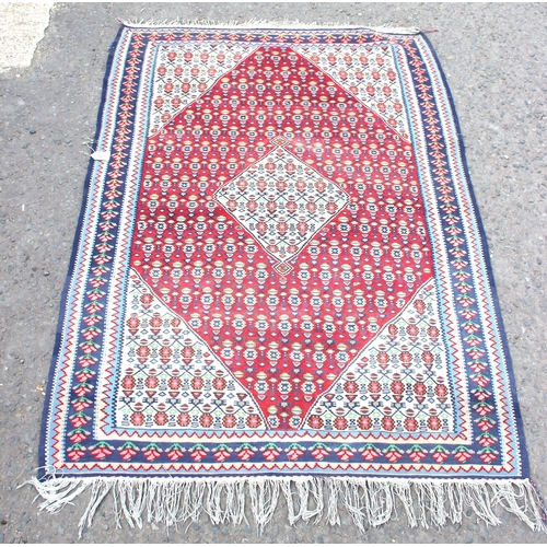 216 - A vintage flat weave Kilim rug, of red, blue and cream ground with geometric patterns, approx 170cm ... 