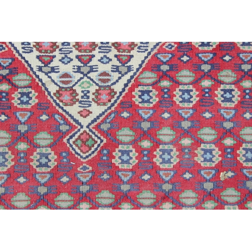 216 - A vintage flat weave Kilim rug, of red, blue and cream ground with geometric patterns, approx 170cm ... 