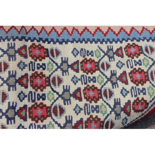 216 - A vintage flat weave Kilim rug, of red, blue and cream ground with geometric patterns, approx 170cm ... 