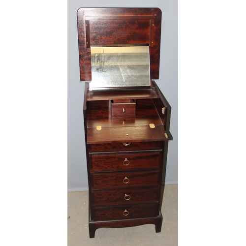 27 - A retro Stag Minstrel 5 chest of drawers with mirror opening dressing table top, approx 57cm wide x ... 