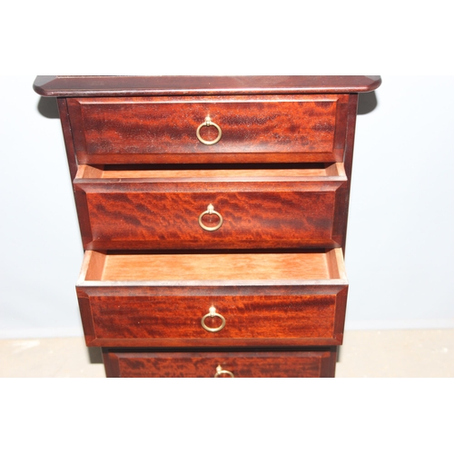 27 - A retro Stag Minstrel 5 chest of drawers with mirror opening dressing table top, approx 57cm wide x ... 