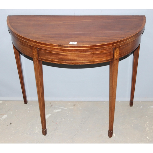 77 - A Georgian mahogany demi-lune card table with marquetry inlay, approx 90cm in diameter when open, ap... 